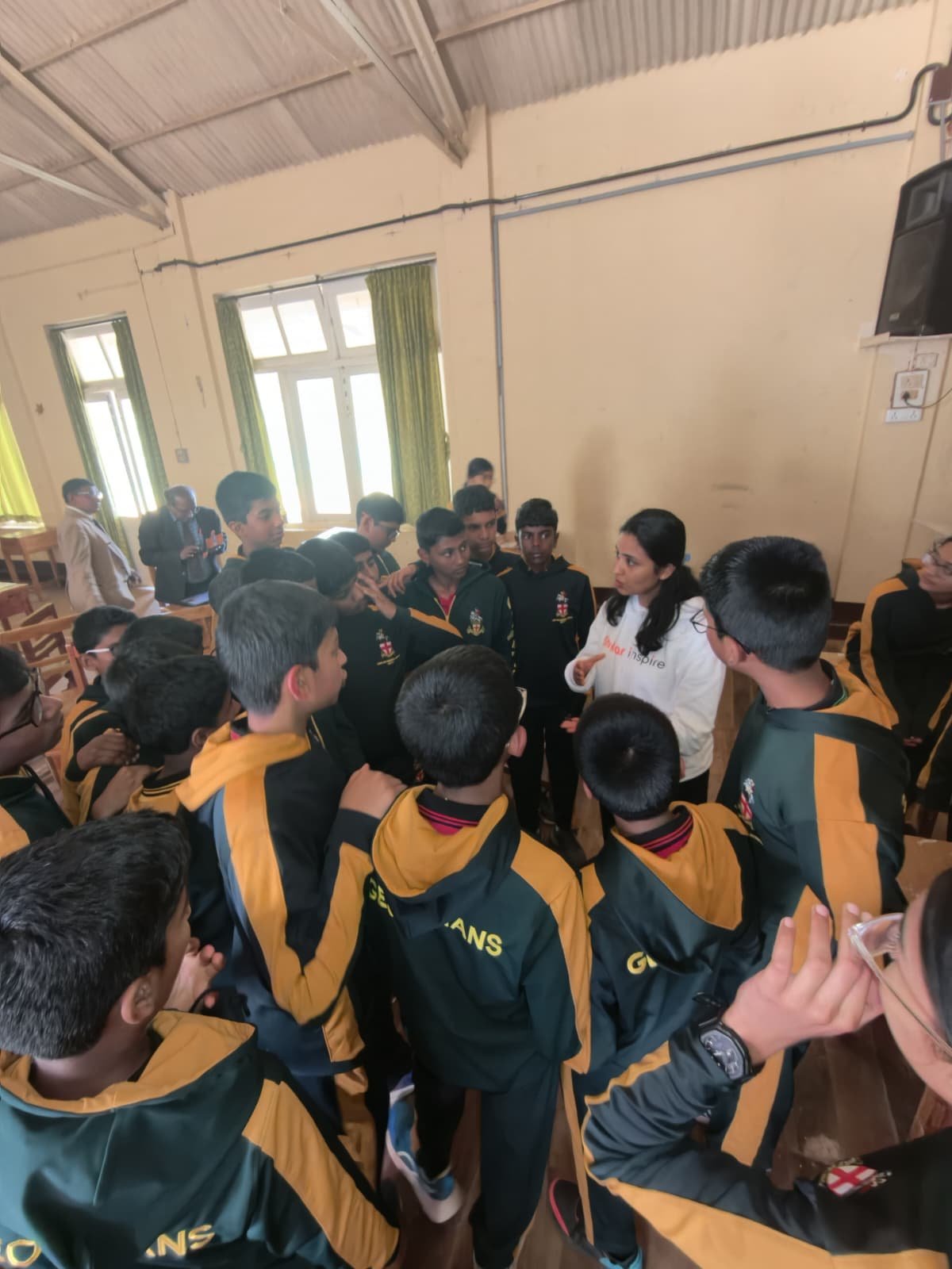 Stellar Inspire educator talking with students during a school session